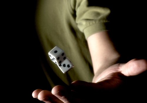 guy in a green shirt throwing dice